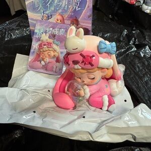 T N T the new toy  Pink and White Sleeping Girl Figurine with bunny